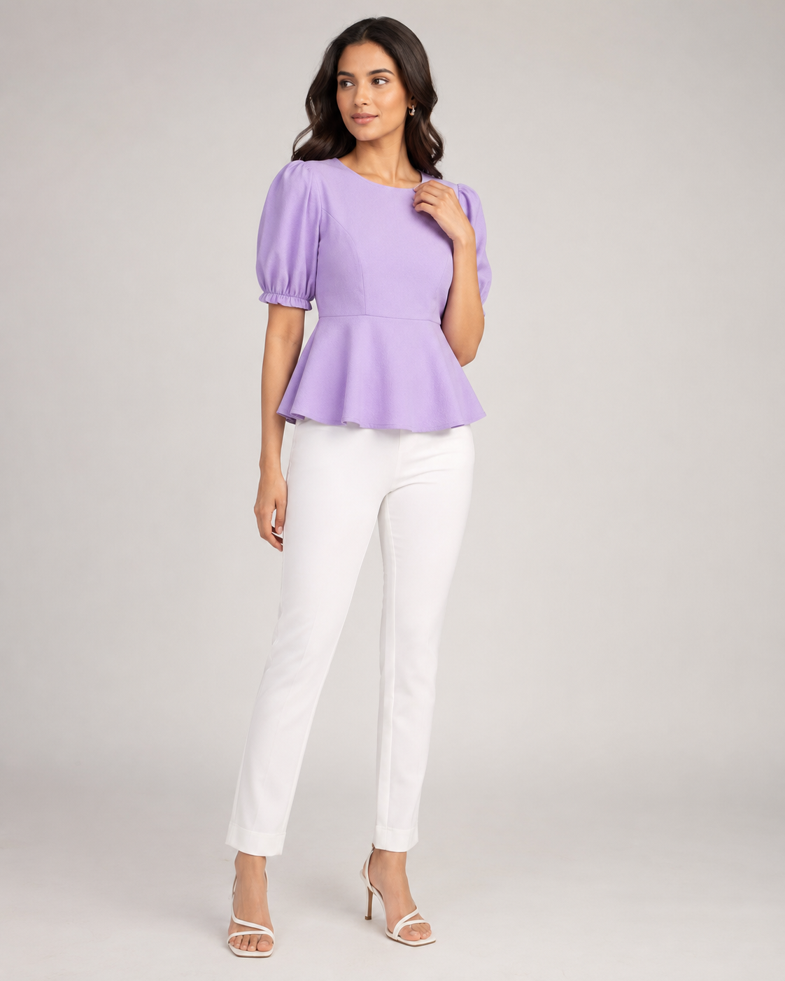 Woman wearing the Dezire Lilac lavender peplum top