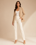 Woman wearing the Dezire Atelier camel tailored blazer
