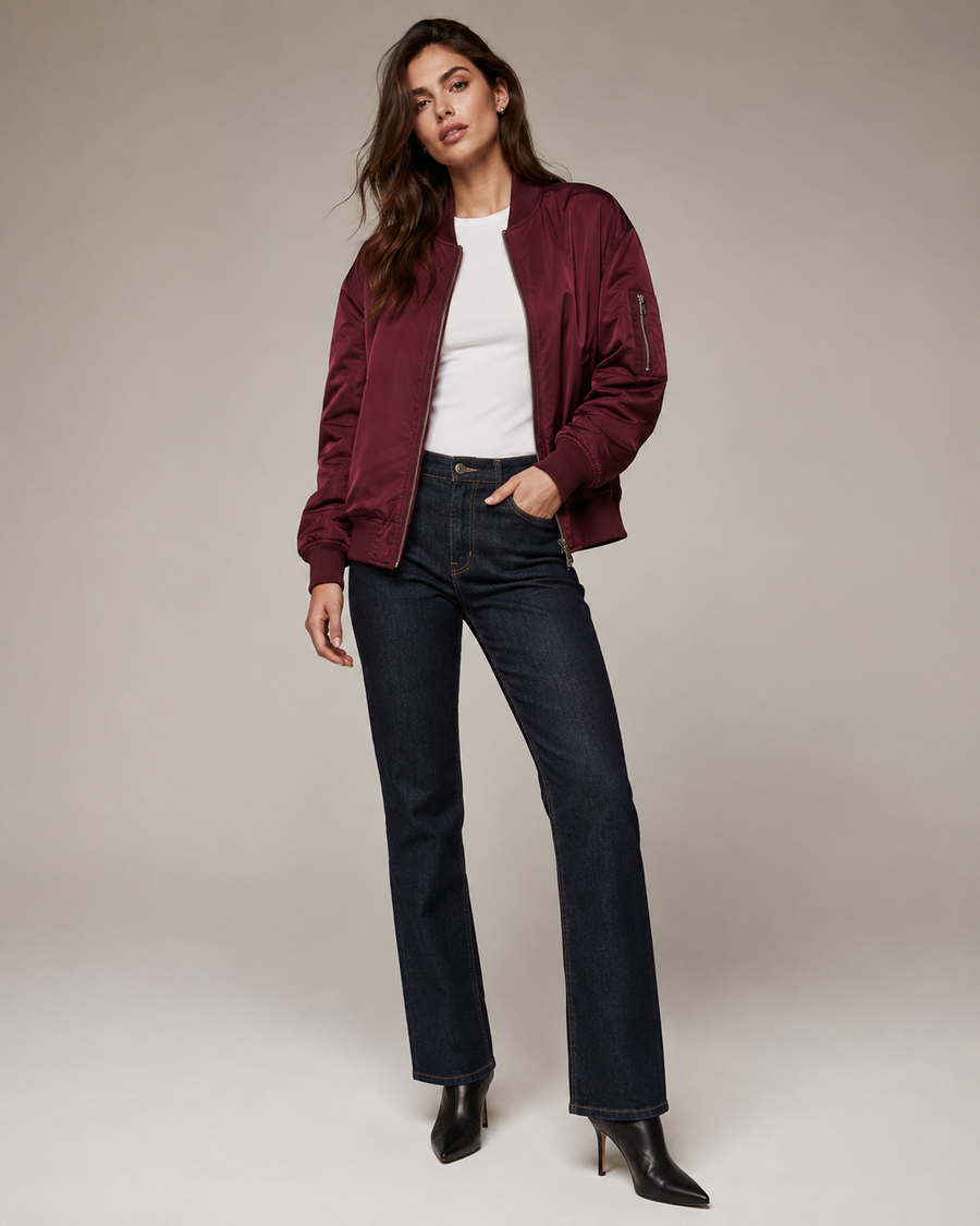 Woman wearing the Dezire Merlot burgundy bomber jacket