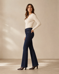 DEZIRE dark indigo high rise flare jeans for women on a studio model