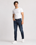 DEZIRE dark indigo slim fit jeans for men on a studio model